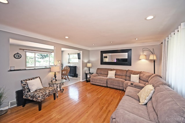 3430 Melodymanor Dr, Colerain Twp, OH 45239 - living area with ornamental molding, a fireplace, light wood-style floors, and recessed lighting