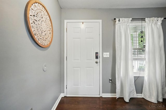 5711 Clemens Dr, Goshen Twp, OH 45140 - foyer with dark wood-type flooring and baseboards