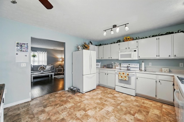 5711 Clemens Dr, Goshen Twp, OH 45140 - kitchen with white appliances, light countertops, white cabinetry, a ceiling fan, and stone finish flooring