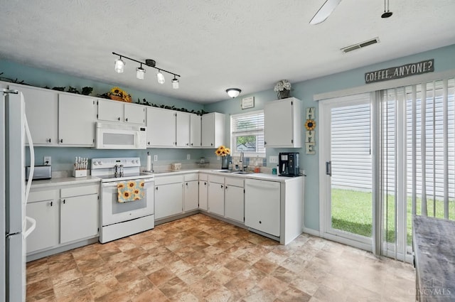 5711 Clemens Dr, Goshen Twp, OH 45140 - kitchen featuring white appliances, a sink, white cabinetry, light countertops, and a textured ceiling