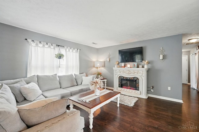 5711 Clemens Dr, Goshen Twp, OH 45140 - living room with wood finished floors, baseboards, and a fireplace