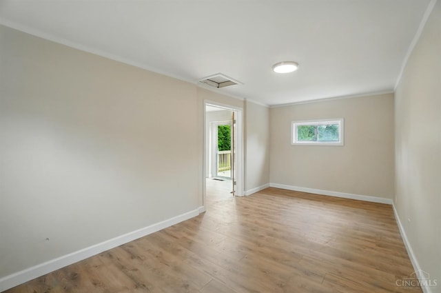 3779 Hopper Hill Rd, Pierce Twp, OH 45255 - unfurnished room with crown molding, baseboards, light wood-style floors, and attic access
