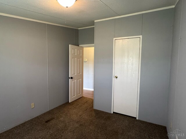 46 Frazier Rd, Jefferson Twp, OH 45148 - unfurnished bedroom with carpet, ornamental molding, and a closet