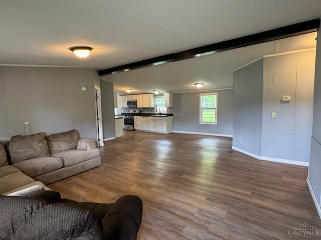 46 Frazier Rd, Jefferson Twp, OH 45148 - living area with dark wood-style flooring, beamed ceiling, and baseboards