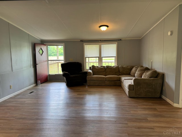 46 Frazier Rd, Jefferson Twp, OH 45148 - living room featuring vaulted ceiling, wood finished floors, and a decorative wall
