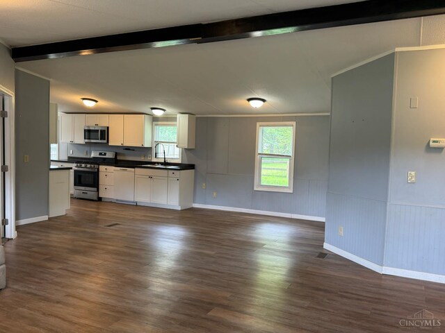 46 Frazier Rd, Jefferson Twp, OH 45148 - kitchen featuring stainless steel appliances, a sink, dark countertops, beamed ceiling, and white cabinetry