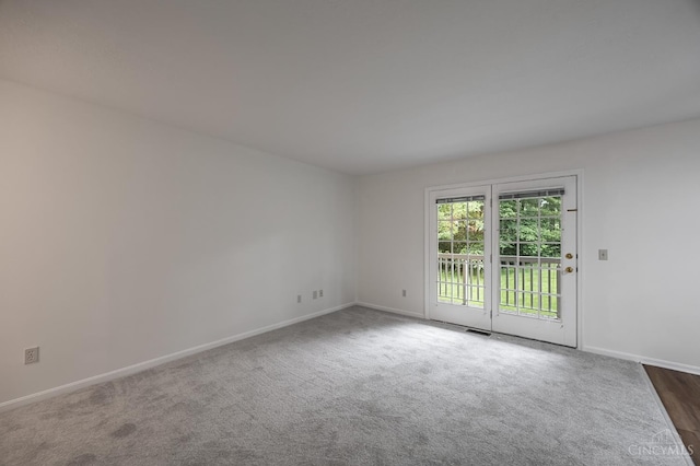 3721 W Galbraith Rd Unit A-2, Cincinnati, OH 45247 - empty room with baseboards and dark carpet