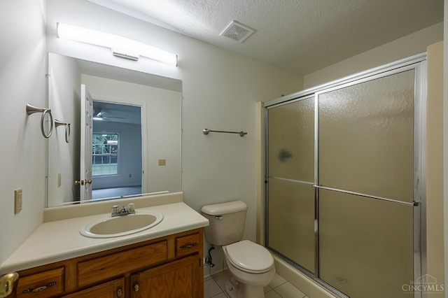 3721 W Galbraith Rd Unit A-2, Cincinnati, OH 45247 - bathroom with vanity, toilet, a shower stall, tile patterned flooring, and a textured ceiling