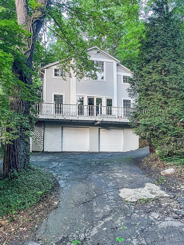 1588 Moon Valley Ln, Anderson Twp, OH 45230 - view of front of house featuring an attached garage and asphalt driveway