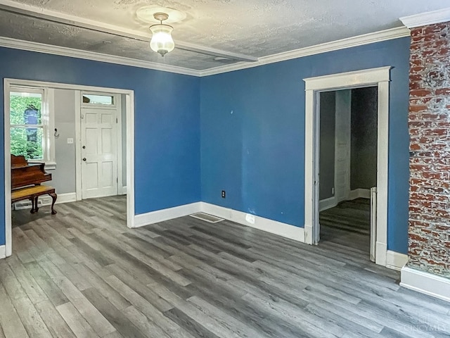 1588 Moon Valley Ln, Anderson Twp, OH 45230 - empty room with wood finished floors, a textured ceiling, and ornamental molding