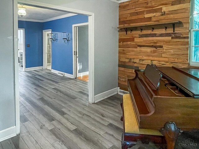 1588 Moon Valley Ln, Anderson Twp, OH 45230 - hallway featuring ornamental molding, wood finished floors, and wood walls