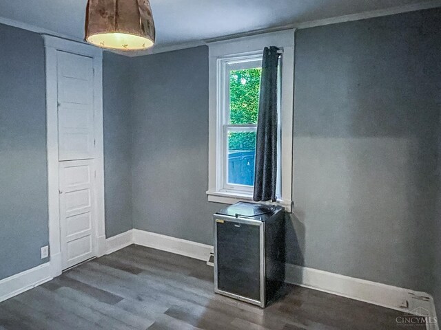 1588 Moon Valley Ln, Anderson Twp, OH 45230 - spare room featuring dark wood-style floors and ornamental molding