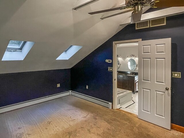 1588 Moon Valley Ln, Anderson Twp, OH 45230 - additional living space with a skylight, carpet, vaulted ceiling, a ceiling fan, and a baseboard radiator