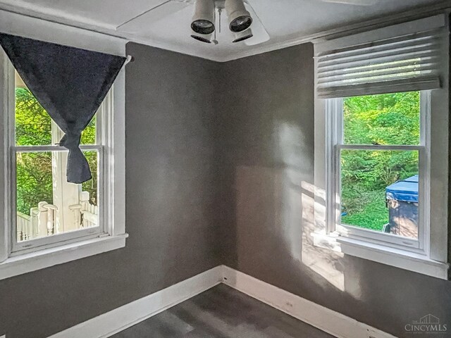1588 Moon Valley Ln, Anderson Twp, OH 45230 - unfurnished room featuring dark wood-style flooring and healthy amount of natural light