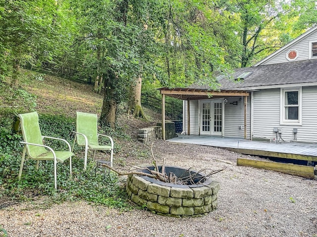 1588 Moon Valley Ln, Anderson Twp, OH 45230 - view of yard with french doors, a fire pit, and a deck