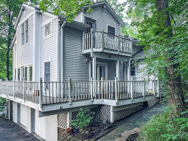1588 Moon Valley Ln, Anderson Twp, OH 45230 - view of side of home with a balcony and an attached garage