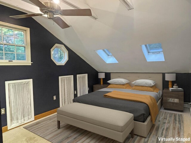 1588 Moon Valley Ln, Anderson Twp, OH 45230 - bedroom featuring a skylight, vaulted ceiling, and a ceiling fan