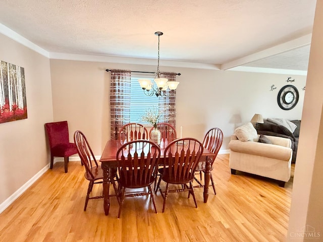 4375 Airycrest Ln, Cincinnati, OH 45211 - dining space with light wood finished floors, a chandelier, and ornamental molding