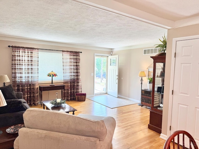 4375 Airycrest Ln, Cincinnati, OH 45211 - living area featuring light wood-type flooring and a textured ceiling