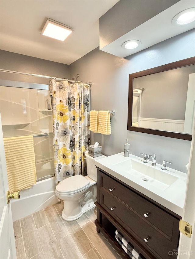 4375 Airycrest Ln, Cincinnati, OH 45211 - full bath with shower / bath combo with shower curtain, vanity, and wood finished floors
