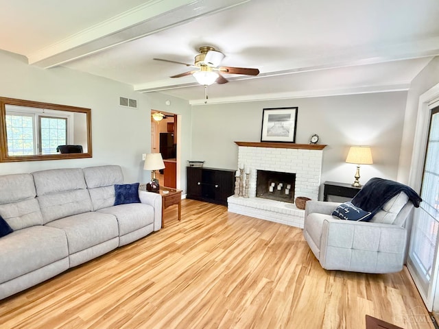 4375 Airycrest Ln, Cincinnati, OH 45211 - living room featuring wood finished floors, a ceiling fan, beam ceiling, and a fireplace