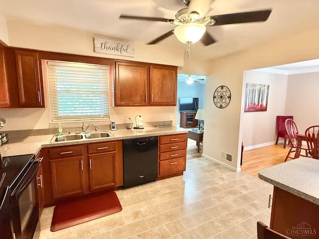 4375 Airycrest Ln, Cincinnati, OH 45211 - kitchen featuring black appliances, a ceiling fan, light countertops, and brown cabinetry