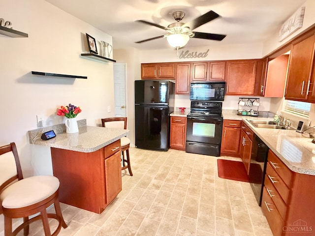 4375 Airycrest Ln, Cincinnati, OH 45211 - kitchen with black appliances, a kitchen breakfast bar, a peninsula, and brown cabinets