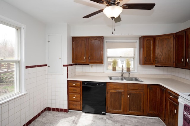 6643 Epworth Rd, Miami Twp, OH 45140 - kitchen with dishwasher, plenty of natural light, light countertops, wainscoting, and tile walls
