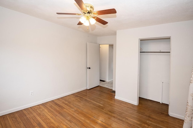 6643 Epworth Rd, Miami Twp, OH 45140 - unfurnished bedroom featuring wood finished floors, a closet, and a ceiling fan