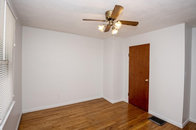 6643 Epworth Rd, Miami Twp, OH 45140 - spare room featuring wood finished floors, a ceiling fan, and a textured ceiling
