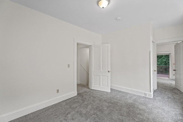 2266 Loth St, Cincinnati, OH 45219 - carpeted spare room with baseboards and a smoke detector