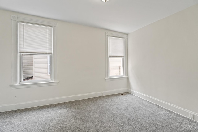 2266 Loth St, Cincinnati, OH 45219 - empty room featuring carpet flooring and baseboards
