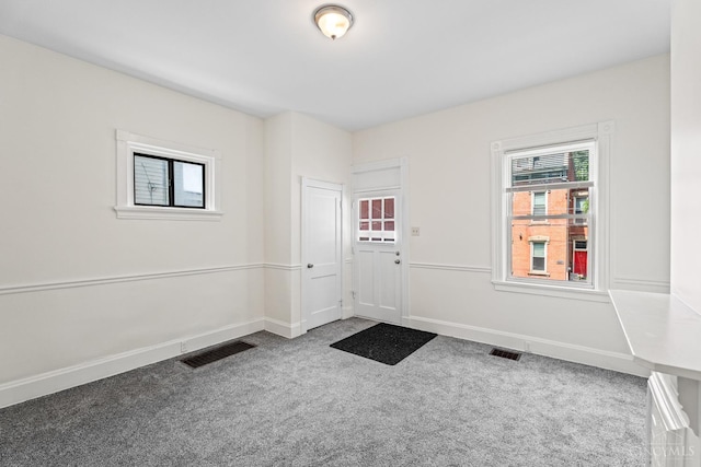 2266 Loth St, Cincinnati, OH 45219 - carpeted entryway featuring baseboards