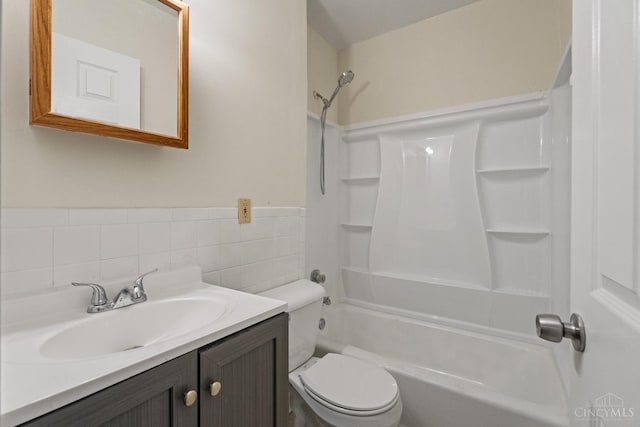 2266 Loth St, Cincinnati, OH 45219 - full bath with shower / tub combination, vanity, and tile walls