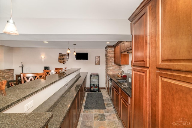 5200 Poets Way, Liberty Twp, OH 45011 - indoor bar with beverage cooler, dark stone finish floors, pendant lighting, and recessed lighting
