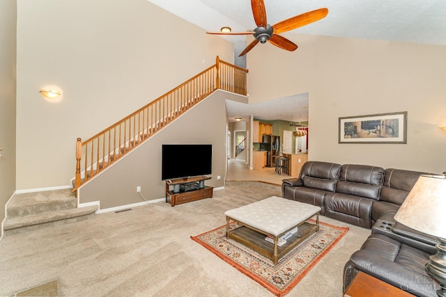 5200 Poets Way, Liberty Twp, OH 45011 - living area with stairway, high vaulted ceiling, carpet flooring, and a ceiling fan