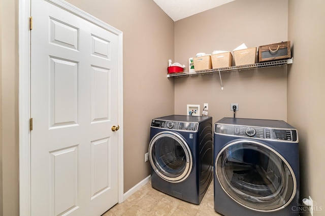 5200 Poets Way, Liberty Twp, OH 45011 - washroom with washer and clothes dryer and baseboards