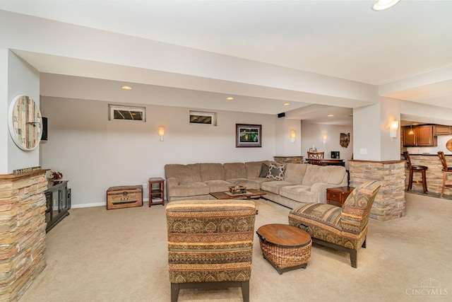 5200 Poets Way, Liberty Twp, OH 45011 - living room featuring light colored carpet, recessed lighting, and a stone fireplace