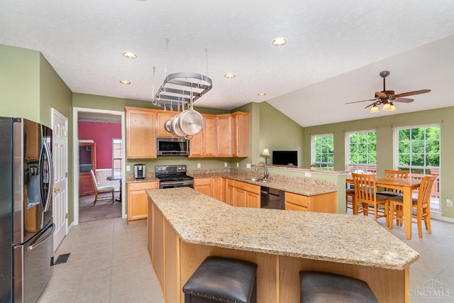 5200 Poets Way, Liberty Twp, OH 45011 - kitchen featuring stainless steel appliances, a peninsula, light brown cabinets, recessed lighting, and light stone countertops