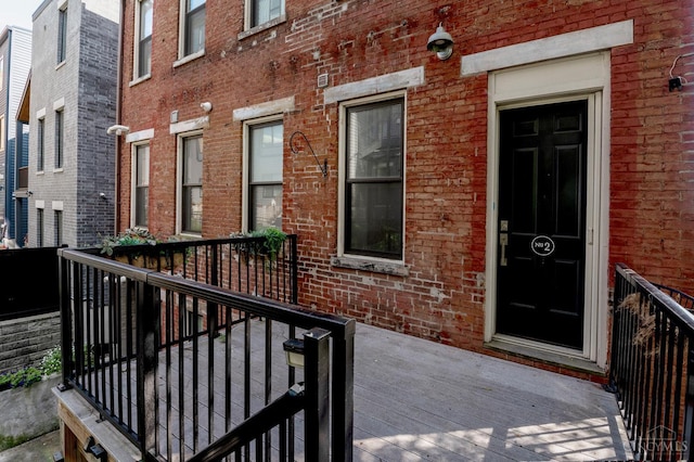 306 Mulberry St Unit 2, Cincinnati, OH 45202 - property entrance with brick siding and a wooden deck