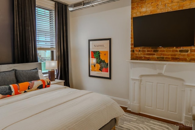 306 Mulberry St Unit 2, Cincinnati, OH 45202 - bedroom with baseboards and wood finished floors