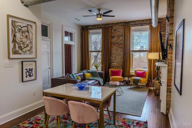306 Mulberry St Unit 2, Cincinnati, OH 45202 - living area featuring brick wall, ceiling fan, and dark wood-type flooring
