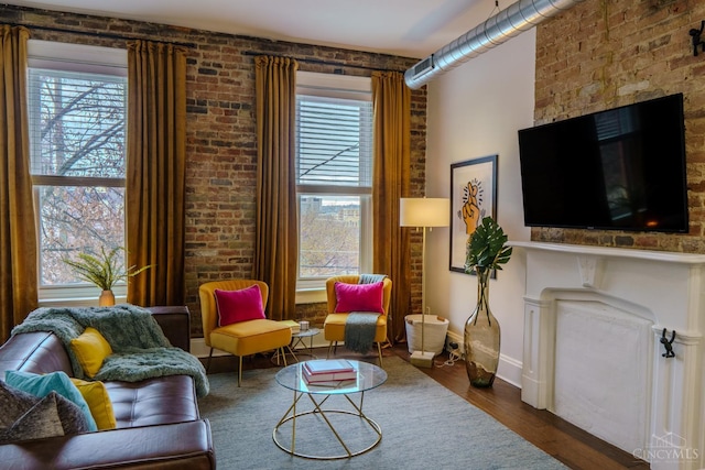 306 Mulberry St Unit 2, Cincinnati, OH 45202 - living room with a fireplace, plenty of natural light, and wood finished floors