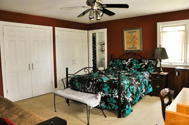 8030 Deershadow Ln, Montgomery, OH 45242 - bedroom with carpet, multiple closets, and a ceiling fan