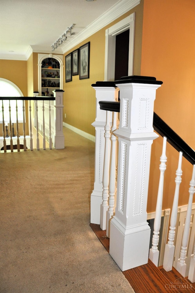 8030 Deershadow Ln, Montgomery, OH 45242 - hall with an upstairs landing, crown molding, carpet flooring, and track lighting
