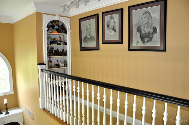 8030 Deershadow Ln, Montgomery, OH 45242 - hallway featuring track lighting, crown molding, and an upstairs landing