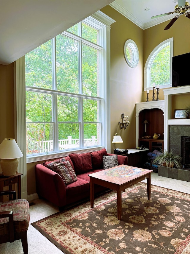 8030 Deershadow Ln, Montgomery, OH 45242 - living area with ceiling fan, carpet floors, a tiled fireplace, and ornamental molding