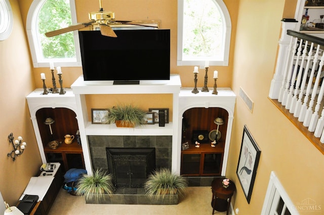 8030 Deershadow Ln, Montgomery, OH 45242 - living room featuring ceiling fan and a tile fireplace