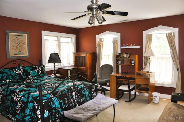 8030 Deershadow Ln, Montgomery, OH 45242 - bedroom featuring multiple windows, carpet, and ceiling fan
