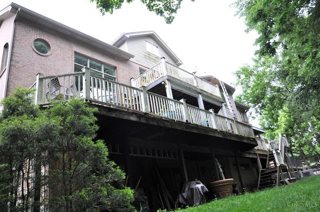 8030 Deershadow Ln, Montgomery, OH 45242 - rear view of property with a wooden deck, stairway, and brick siding